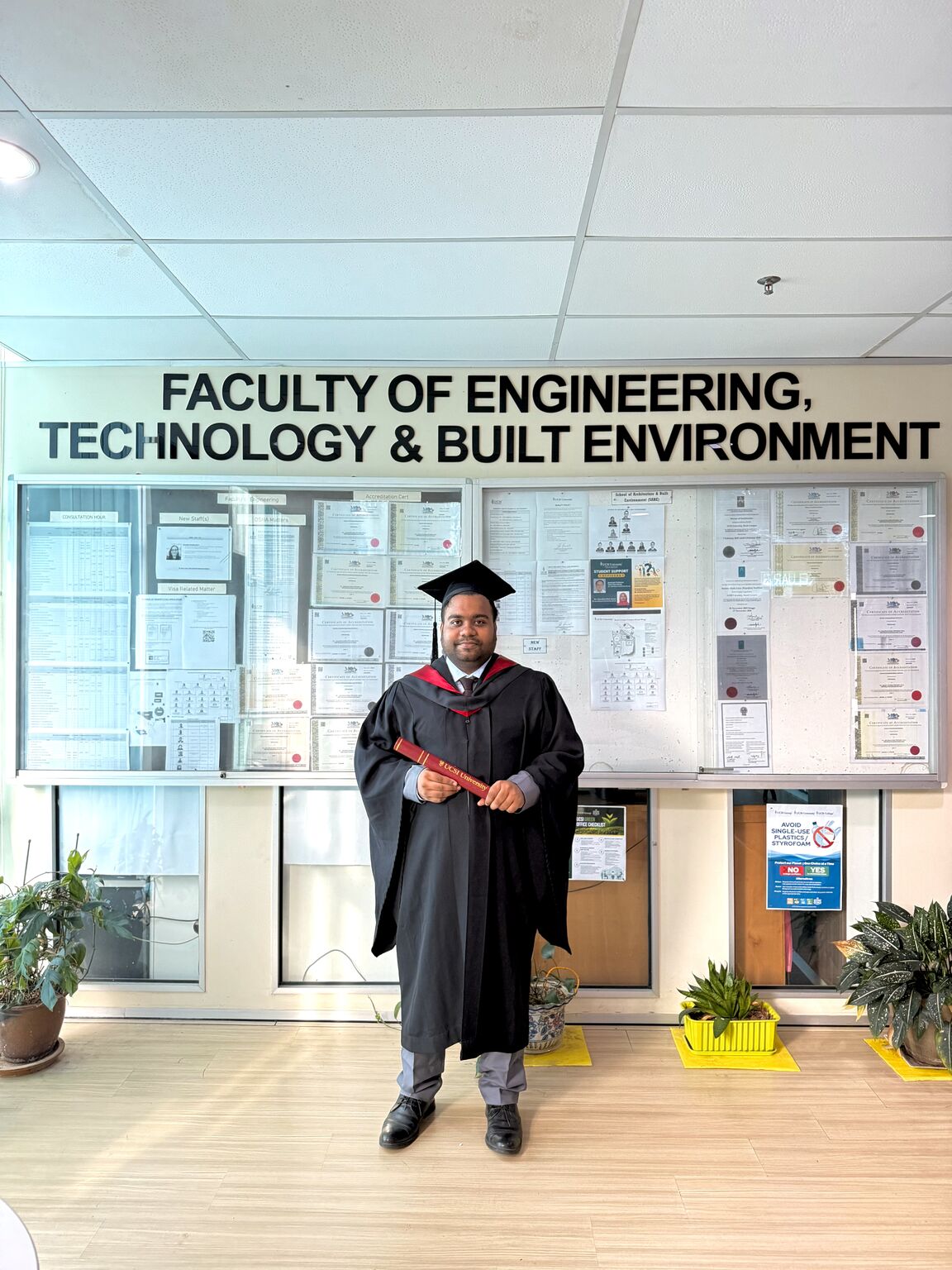 In graduation robes at the Faculty of Engineering, Technology and Built Environment