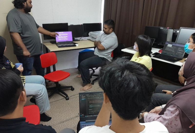 Interns working at their computers at KidoCode