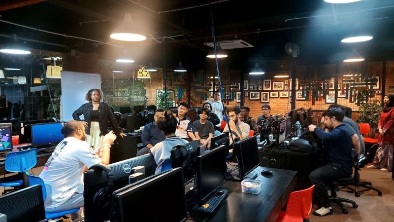Interns gathered for a team meeting in the KidoCode office